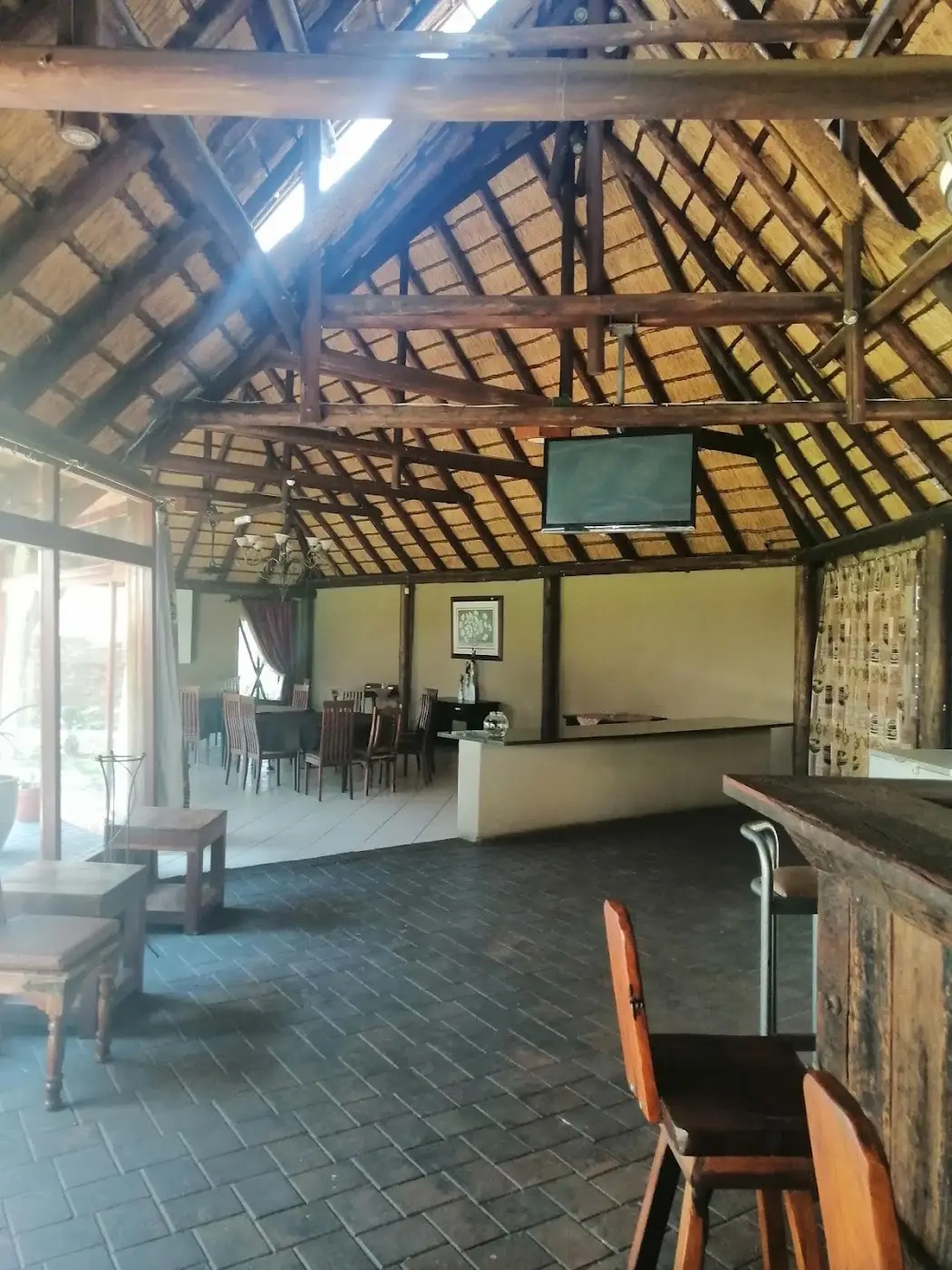 Inside the lapa: the thatch, the bar and the dartboards